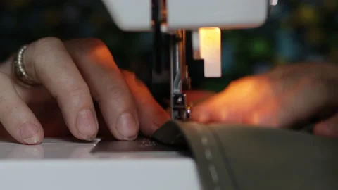 Sewing machine on clothes and material. Tailor at work. Close up. Art of sewing Video stock 135138880