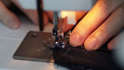 Sewing machine on clothes and material. Tailor at work. Close up. Art of sewing Video stock 135141238