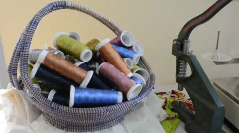 Sewing machine, colored sewing thread in a basket Stock Footage 40745333