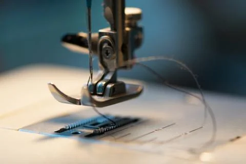 Sewing machine. Detail on thread and needle. Stock Photos