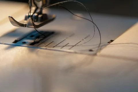 Sewing machine. Detail on thread and needle. Stock Photos