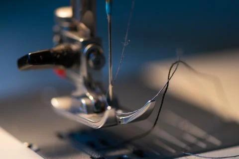 Sewing machine. Detail on thread and needle. Stock Photos