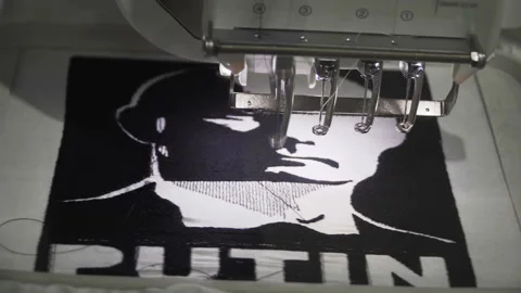 Sewing machine draws a portrait of Putin Stock Footage 89357142