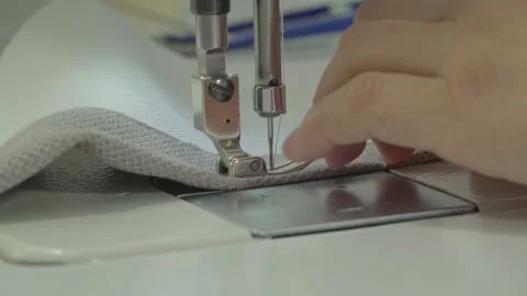 Sewing machine with fabric and thread, closeup woman's hands. Stock Footage 259939111