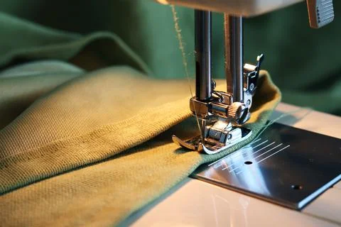 Sewing machine with fabric and thread close-up. Fabric processing on a sewing Stock Photos