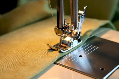 Sewing machine with fabric and thread close-up. Fabric processing on a sewing Stock Photos