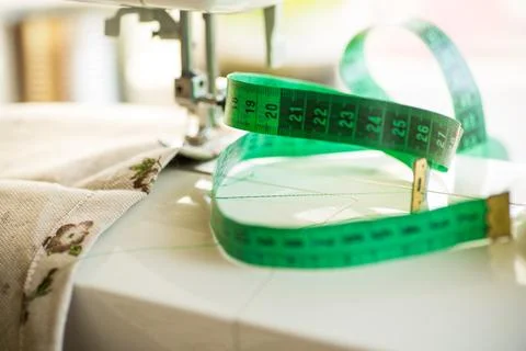 Sewing machine with fabric and threads for sewing, close-up. The working proc Stock Photos