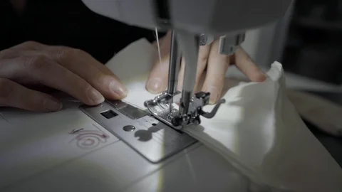 Sewing machine, hands preparing a white mask Stock Footage 127040627