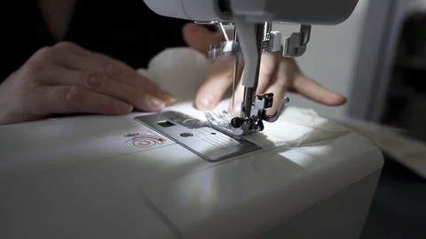 Sewing machine, hands preparing a white mask Stock Footage 127041219