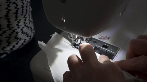 Sewing machine, hands preparing a white mask Stock Footage 127041378