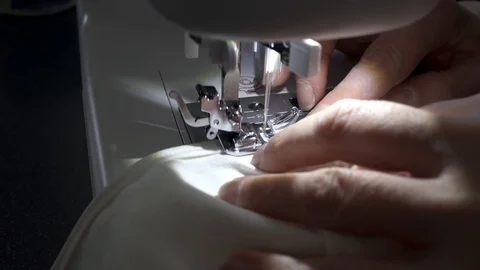 Sewing machine, hands preparing a white mask Stock Footage 127041594