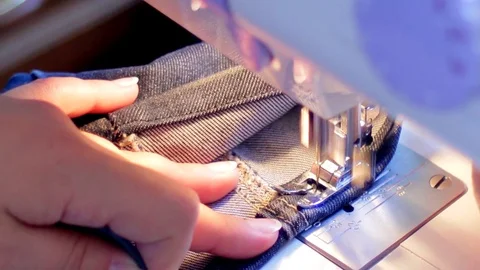 Sewing machine hemming pants blue Stock Footage 69867146