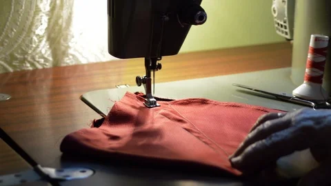 Sewing machine knitting a fabric Stock Footage 86990241
