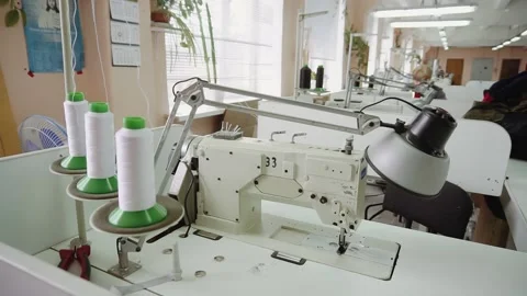 Sewing machine lamp and thread coils at seamstress workplace Stock Footage 236907874