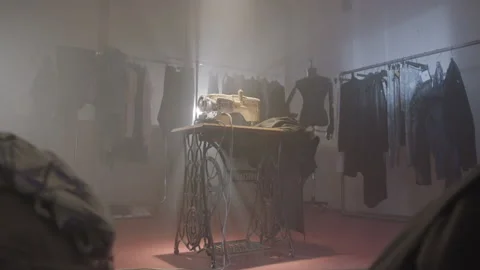 Sewing machine in the middle of a dark room Video stock 220014228