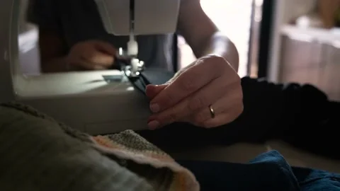 Sewing machine in motion. The close-up of the sewing machine Stock Footage 155179603
