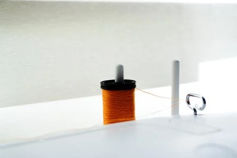 Sewing machine needle bobbin and stitch settings details close up view 写真素材