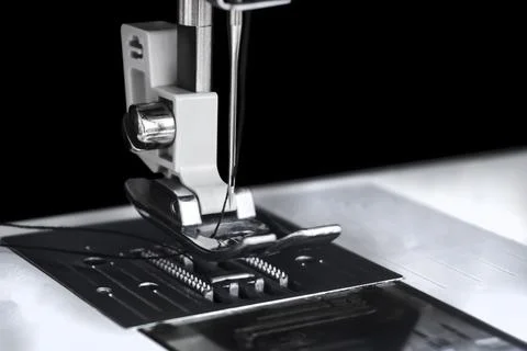 Sewing machine needle close-up on a black Stock Photos