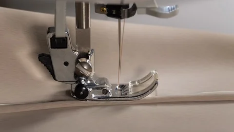 Sewing machine needle fast motion. Macro of sewing machine mechanism. 4K Video stock 129399767