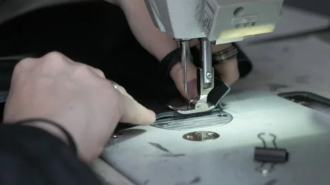 Sewing Machine Needle in Motion. Close-up of sewing machine needle rapidly moves Stock Footage 120064836