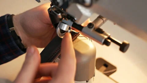 Sewing machine needle in motion. A close-up of the needle of a sewing machine Stock-Footage 126006257