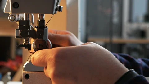 Sewing machine needle in motion. A close-up of the needle of a sewing machine Stock Footage 126168905