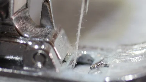 Sewing Machine Needle in Motion: Close-up of sewing machine needle rapidly movin Stock Footage 126498861