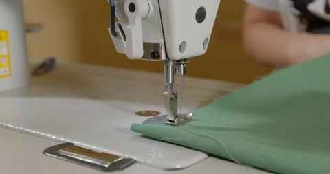 Sewing Machine Needle in Motion. Close-up of sewing machine needle rapidly moves Stock Footage 131134257