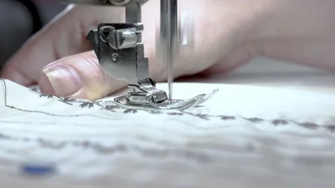 Sewing machine needle in motion. Close-up of a sewing machine needle moving up Stock Footage 141355565