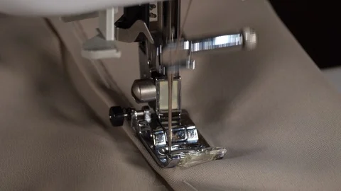 Sewing machine needle in motion. Needle of sewing machine slow moving. 4K Video stock 129337794