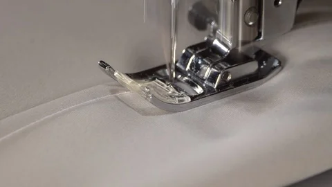 Sewing machine needle moving rapidly, close up. Sewing fabric by sewing machine Stock Footage 129570710