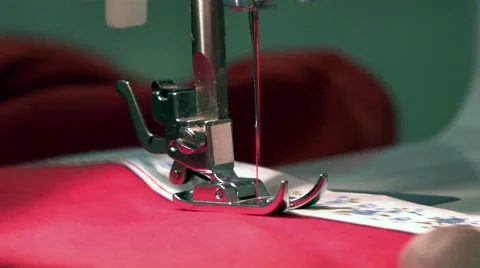 Sewing machine needle pierces the elastic tape to the fabric making joint Stock Footage 67846222