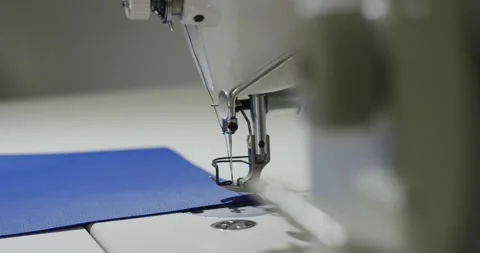 Sewing Machine Needle Piercing Blue Textile Fabric, Tailor Workshop, Macro Shot Stock Footage 341316232