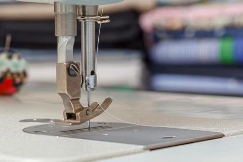 Sewing machine needle with thread and fabric Stock Photos