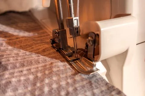 Sewing machine, overlocker, serger close up view, overlock seam. Stock Photos