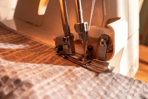 Sewing machine, overlocker, serger close up view, overlock seam. Stock Photos