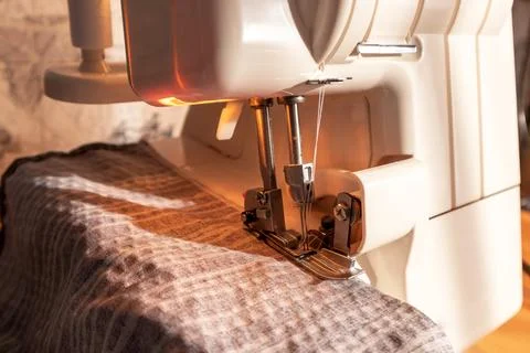 Sewing machine, overlocker, serger close up view, overlock seam. Stock Photos