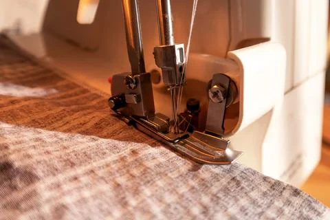 Sewing machine, overlocker, serger close up view, overlock seam. Stock Photos