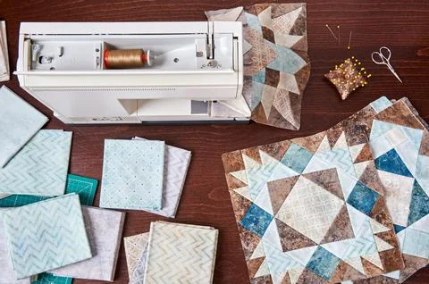 Sewing machine with patchwork block of quilt, top view 스톡 사진