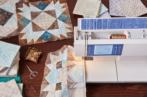 Sewing machine with patchwork block of quilt, top view Stock Photos