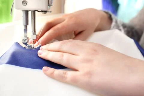 Sewing on a machine. 스톡 사진
