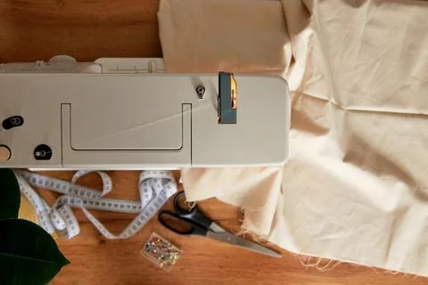 Sewing machine with piece of fabric on table. Stock Photos