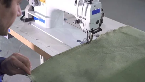 Sewing machine in the process, man's hands Stock Footage 97923100