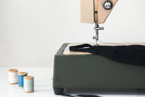 Sewing machine the process of sewing  on white isolated background Stock Photos