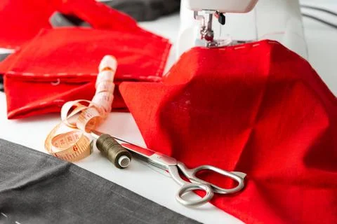 Sewing machine with red and gray fabric Stock Photos