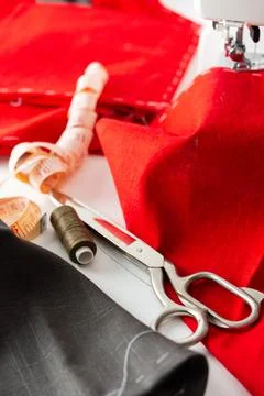 Sewing machine with red and gray fabric Stock Photos