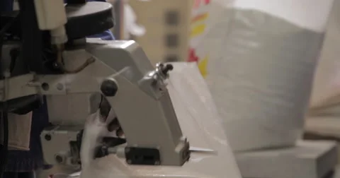Sewing Machine For Sacks In Working Hands (4K) Stock Footage 60937676