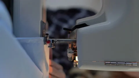 Sewing machine scribbling fabric. Tailoring at the workshop. Stock Footage 224652532