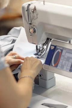 Sewing machine scribbling fabric. tailoring at the factory Stock Photos