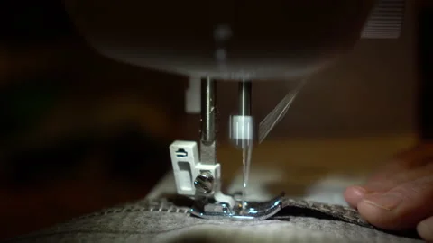 On a sewing machine sew clothes close-up. Dressmaker sews fabric. Stock-Footage 131064242
